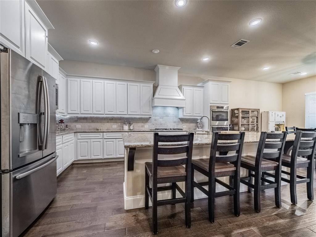 beautiful cabinets with storage on top also