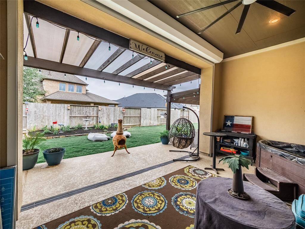 the covered patio has a auto hurricane shutter and the  3 person hot tube stays with the home