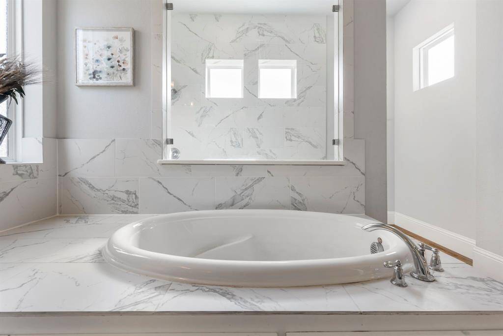 Relax and unwind in the serene garden tub.