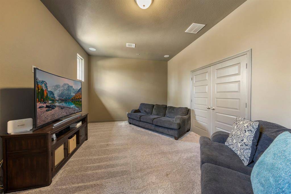 Media room located off the second-floor game room is wired for surround sound and projector ready for set up!