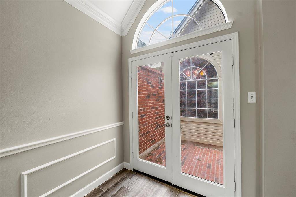 Double doors lead to the outdoor atrium, perfect for a seating area, garden or hanging plants!  Or maybe outdoor Yoga!