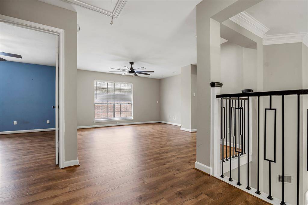 A spacious game room upstairs provides the perfect spot for family entertainment.