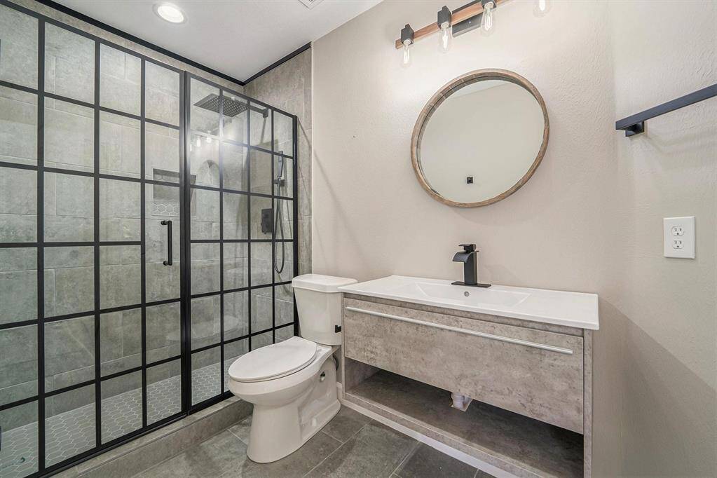 Wow! This upstairs bathroom has been gorgeously updated. A stunning, oversized shower awaits you!