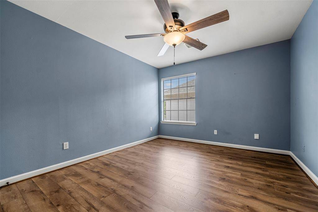 A touch of color makes this secondary bedroom so serene and ready for a new resident to make it their own!