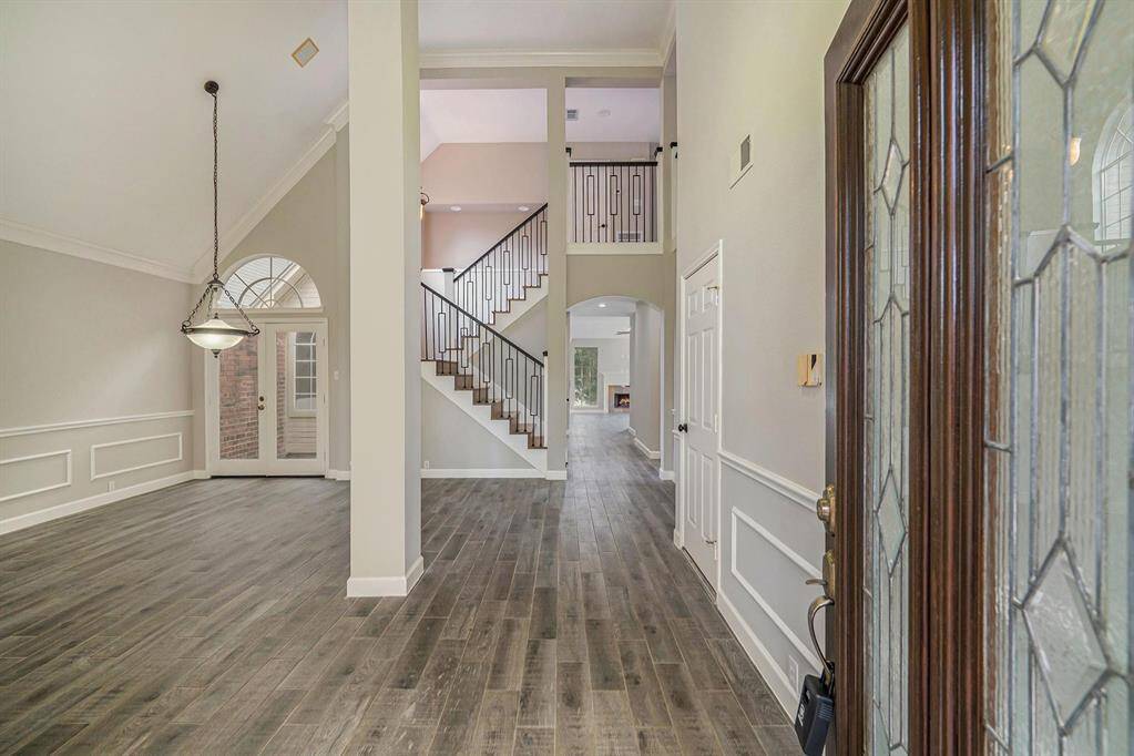 Open the door to a fabulous home! Gorgeous wood tile flooring flows throughout most of the first floor creating a seamless look, that is so easy to maintain!