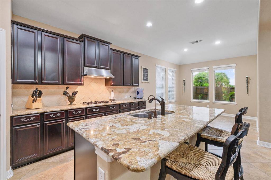 This sunny kitchen and dining nook is perfect for your morning coffee or weekend brunch. With views of the backyard and plenty of prep space, it’s the heart of the home.