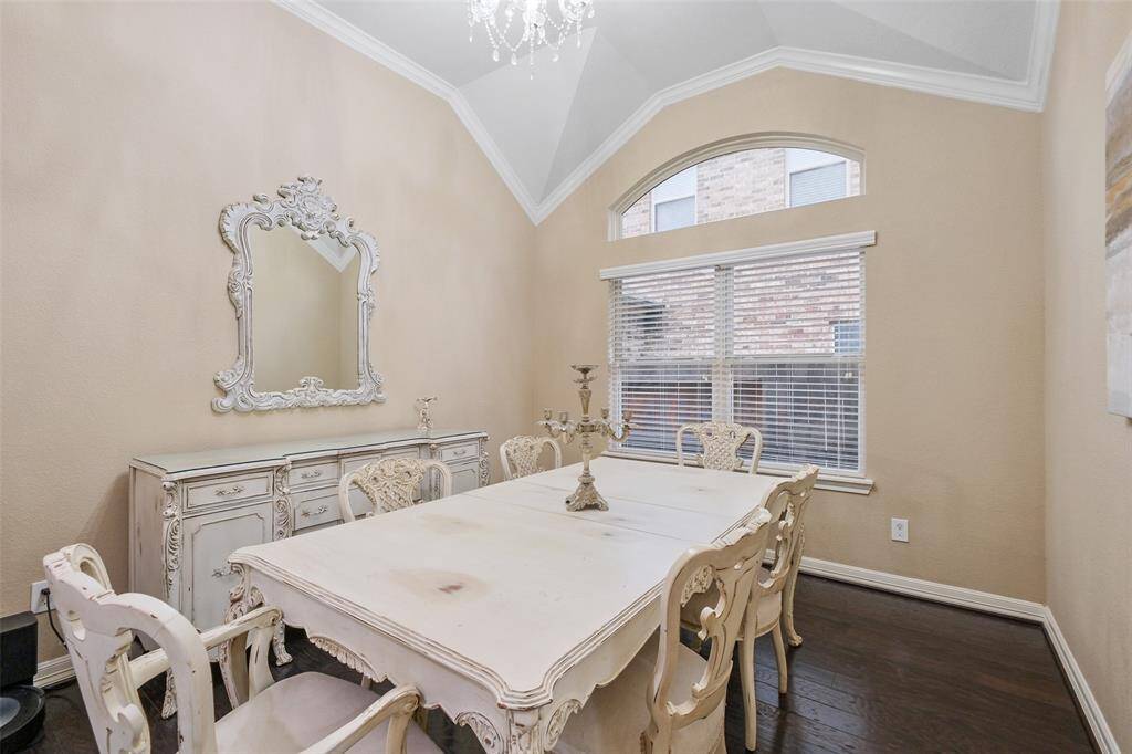 Elegance meets everyday living in this formal dining room with crown molding and a stunning chandelier. Perfect for holiday feasts, birthday dinners, or a casual wine night just because.