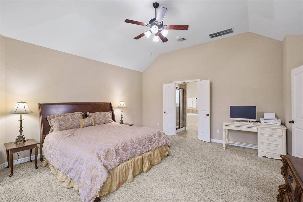 With soaring ceilings, plush carpet, and peaceful tones, the primary suite is the perfect blend of comfort and luxury—with a layout that easily accommodates a sitting area or workspace.