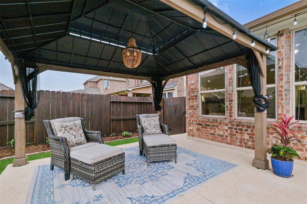 This bolted-down poolside gazebo brings resort-style relaxation to your own backyard. Enjoy the breeze and unwind beneath a custom chandelier that adds just the right touch of glam.