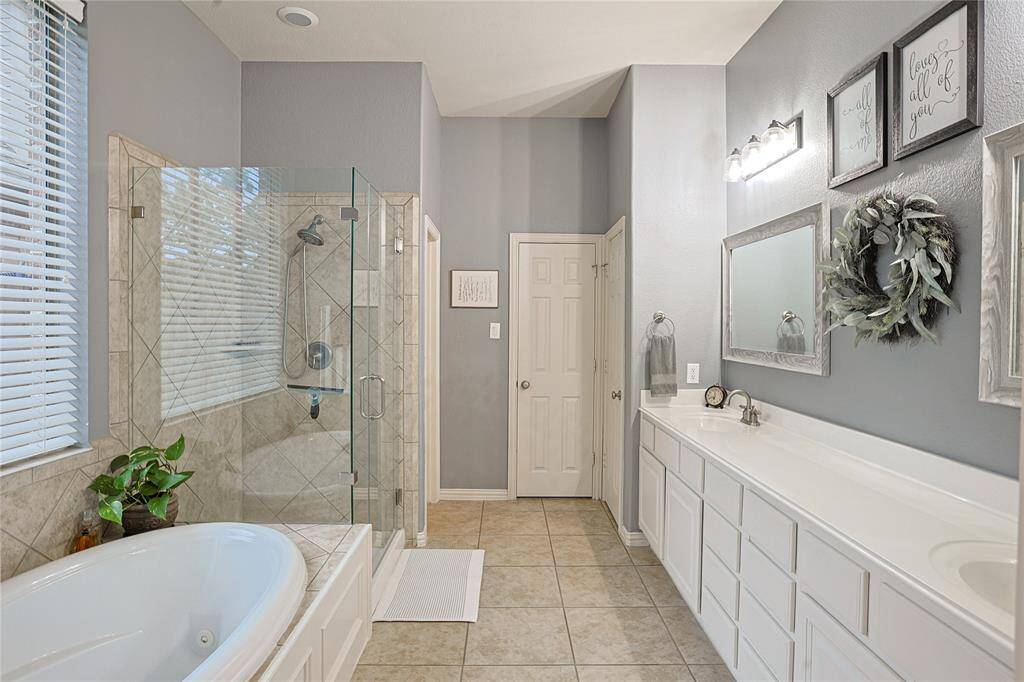 Primary ensuite with jetted tub and separate shower