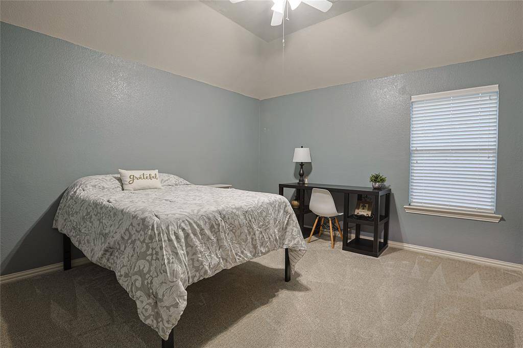 One of three secondary bedrooms upstairs
