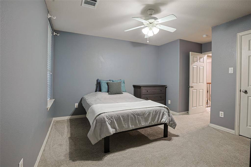 This secondary bedroom has the access point for the Texas Basement (large walk in attic)