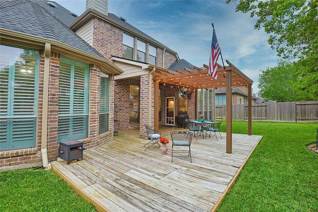 Covered outdoor living space.Note gutters installed 2024