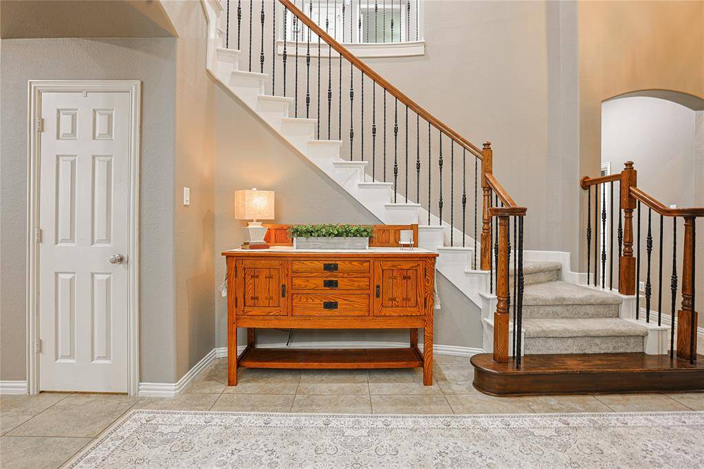 Grand foyer is an impressive entrance into your home. The door you see is for under stair storage (tons!)