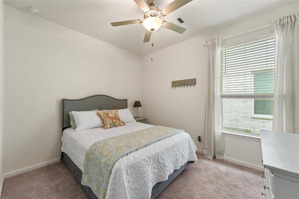 Comfortable second bedroom with ample space. Has closet for added storage, perfect for family or guests.