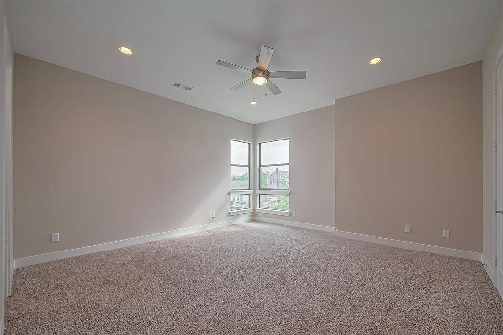 Bedroom #2 is generously sized at 16.1 x 15.4 and features two large corner windows that overlook the quiet residential street of Laird. The spacious room provides plenty of wall space, making it easy to display and arrange furniture to suit your style. It’s a versatile and inviting space, perfect for a second owner's suite or any other use you desire.