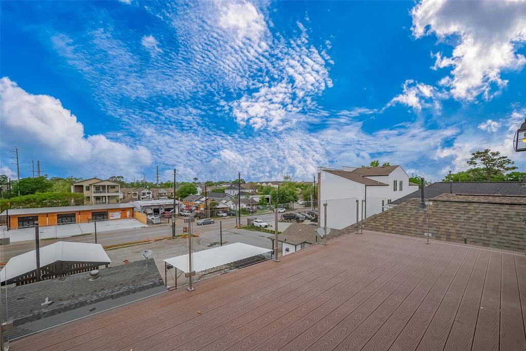 The glass railings offer a seamless view of the vibrant restaurants and shops along N. Durham, making this balcony the perfect spot for people-watching or unwinding after a long day. It’s just an easy walk to grab a quick bite with friends, adding convenience and excitement to your daily routine.