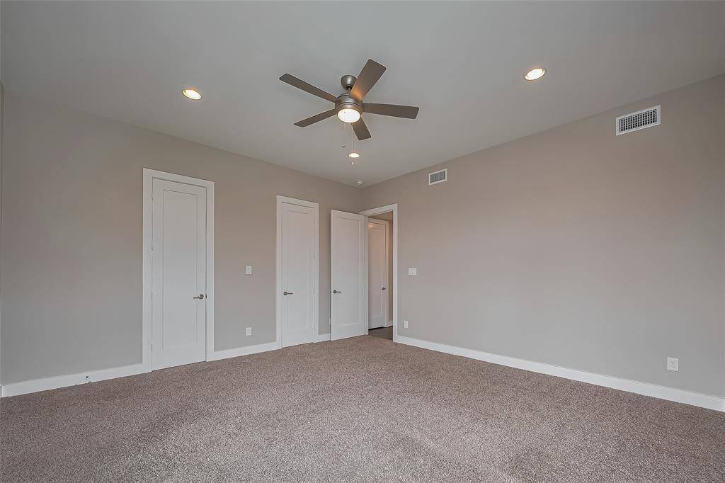 Bedroom #4 features two lighted walk-in closets, each equipped with stacked rods for ample clothes storage. The thoughtful design provides plenty of space for organization, ensuring your wardrobe stays neat and easily accessible.