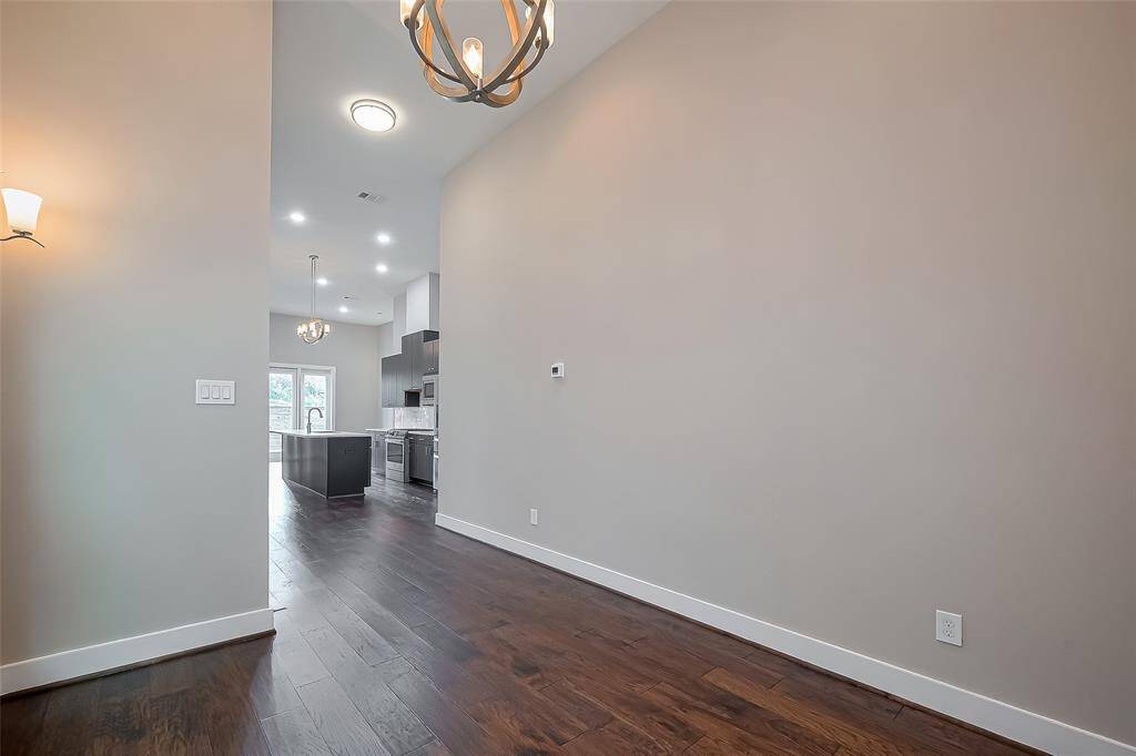 Prefer a workspace? While open to the kitchen and living room, the dining area is tucked off to the side—making it a great spot for a stylish home office setup. With its defined space and modern design, it offers a functional yet connected place to work or create.
