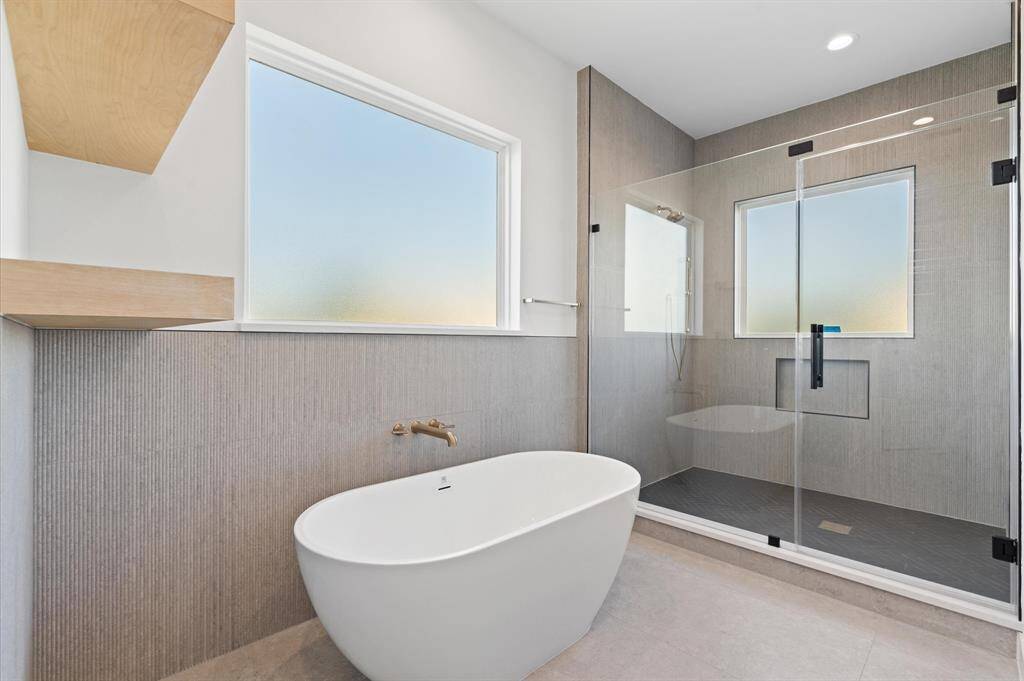 Frameless shower and free standing soaking tub