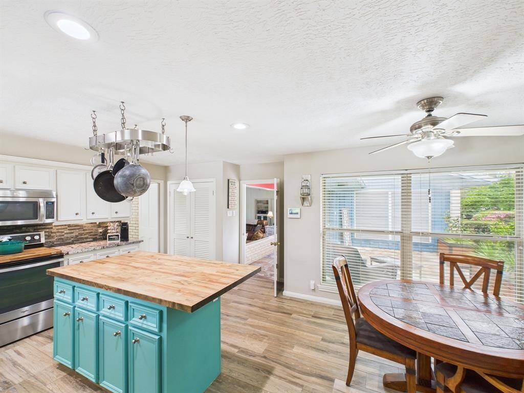 Kitchen is at the front of the home, but has sight lines to the pool area!