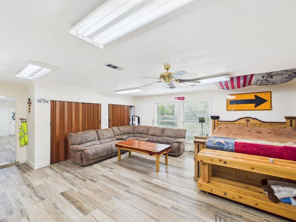 Currently used as an additional bedroom this is the old 2 car garage, fully converted to interior space with direct access to the current 3 car garage. Great for a man cave!