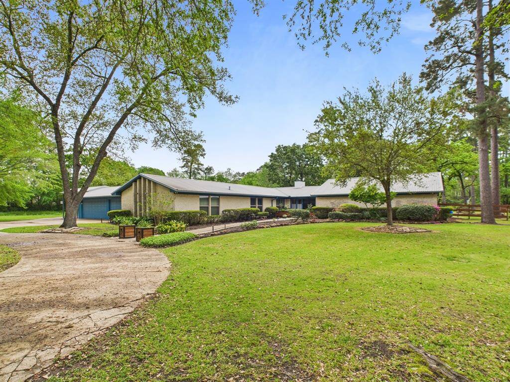 Private circle driveway and plenty of parking with a 3 car garage and carport!