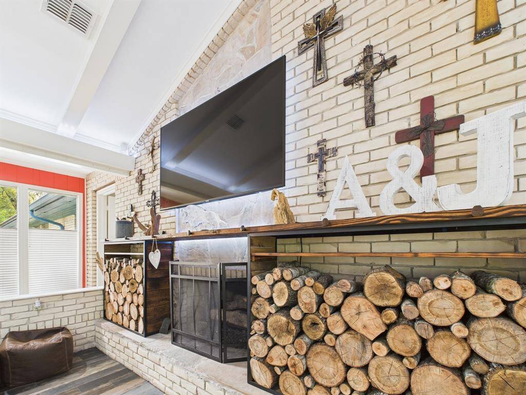 Custom Mantle and wood rack added in 2024.