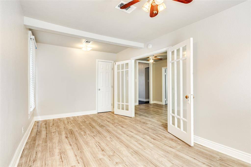 Back bedroom that could also be used as large dining room, game room or den.