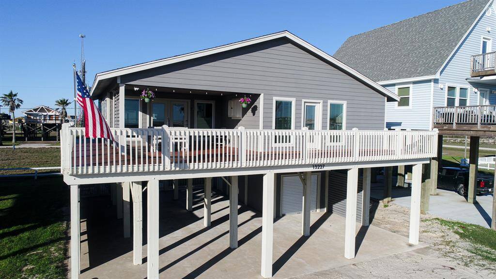 Stunning beachfront home with expansive deck and ocean views. Perfect for serene coastal living.