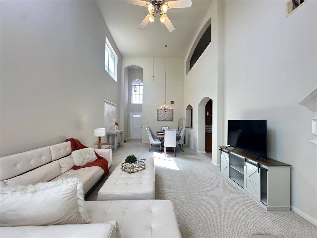 Living room w/double high ceiling
