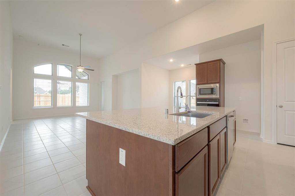 Huge eat-in island with granite countertop
