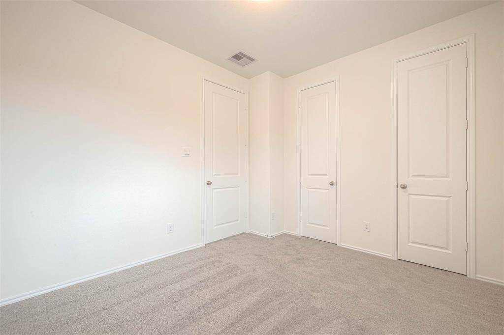 secondary bedroom with shared bathroom
