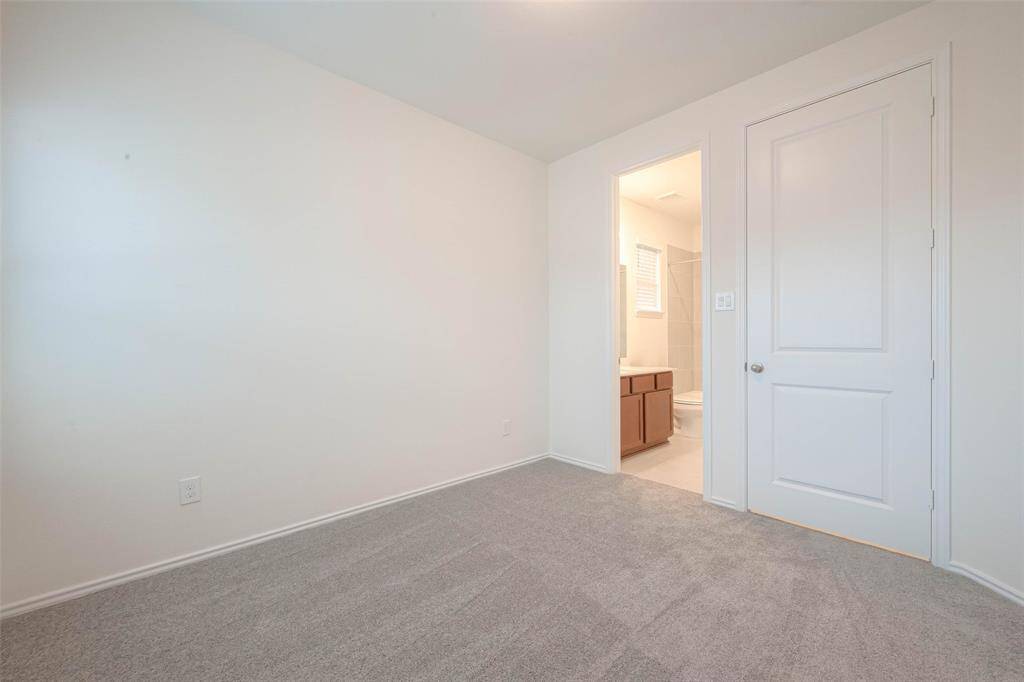 secondary bedroom with shared bathroom