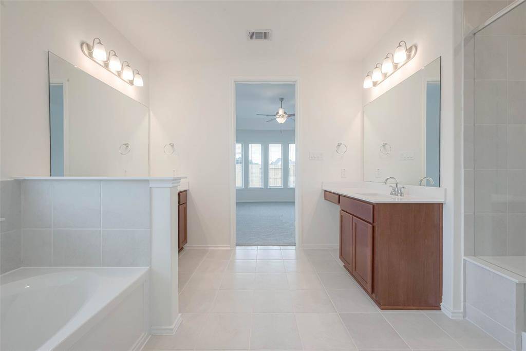 An ample storage and accent light ideal for your morning routine.