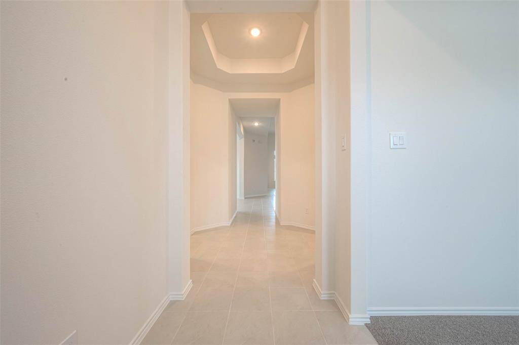 Formal entry foyer with octagonal design and trey ceiling, setting the stage for the elegance that lies within.