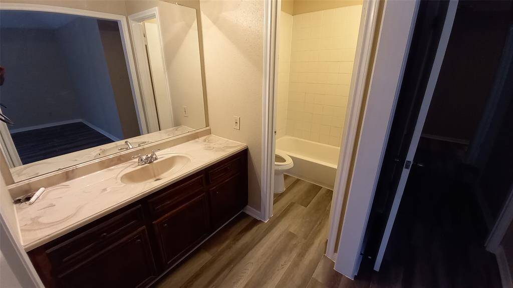 Master bath has large vanity & separate bath/toilet area.