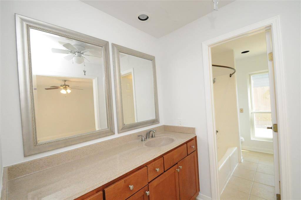 Spacious dual vanities in the primary en suite.