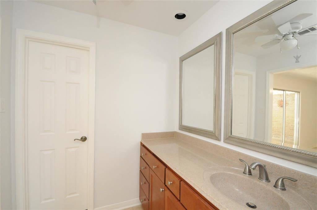 Walk-in closet is 1 of 2 closets in primary bedroom.