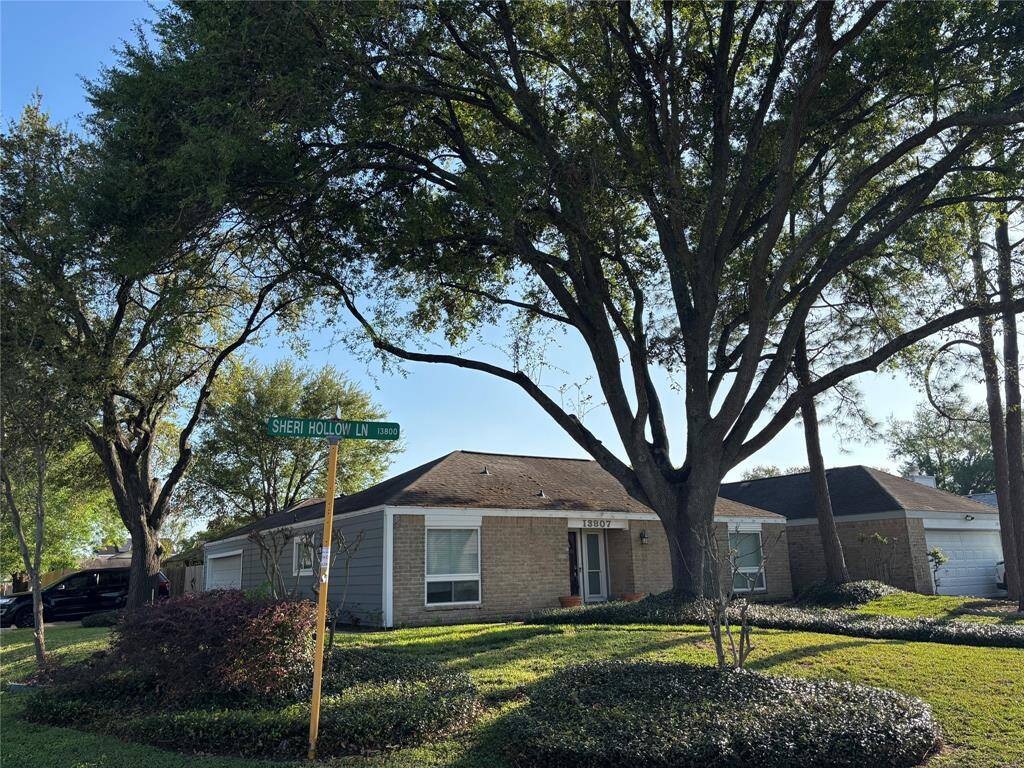 Prime corner lot with great curb appeal and mature trees.