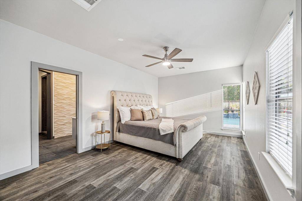 The primary bedroom with space for large furniture and pretty views.