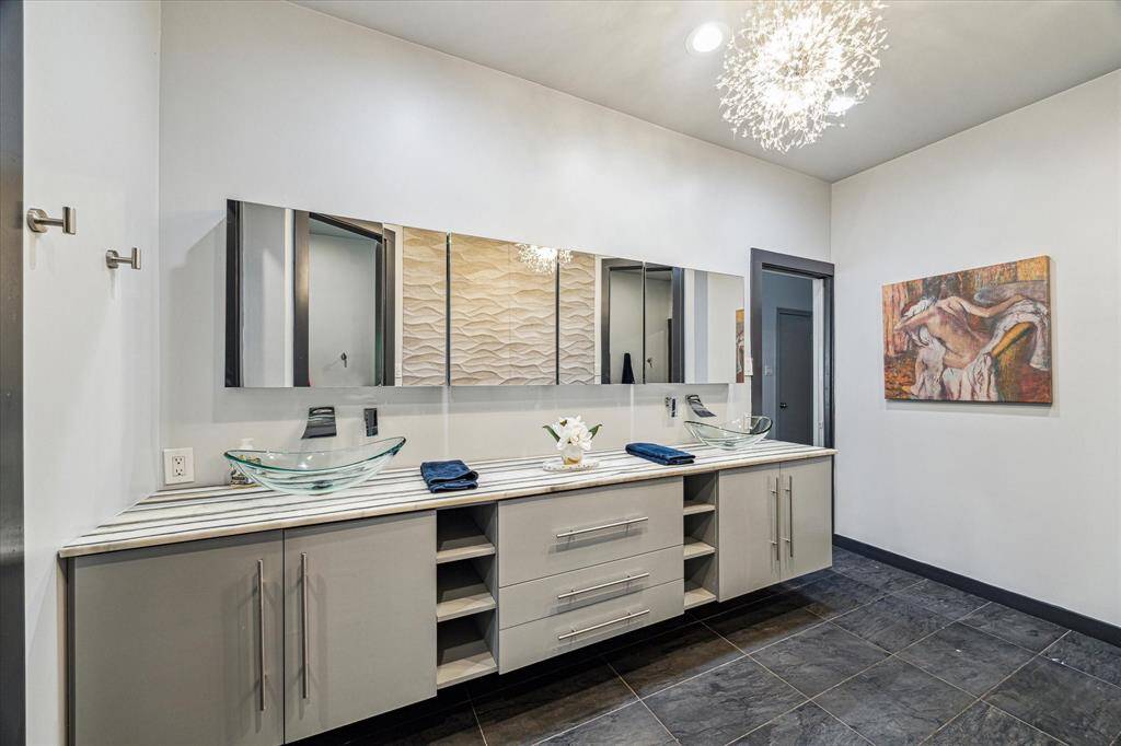 Double sinks, the wall of mirrors open to more mirrors, making it easy to see the back of your hair!