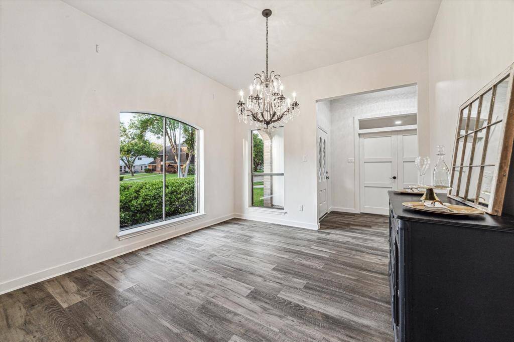 A fantastic chandelier that stays with the home and plenty of room for a big table.