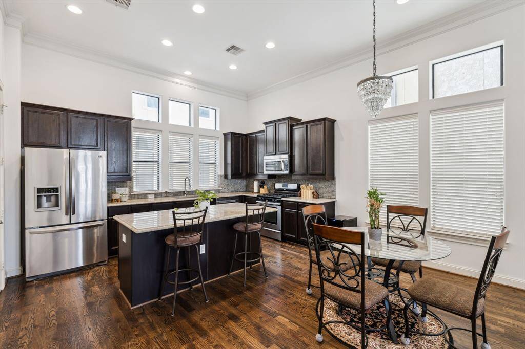 Another view of the kitchen and dining spaces.