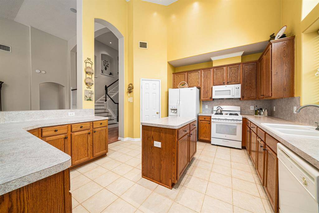 Bright and welcoming kitchen with microwave and gas stovetop just replaced March 2025