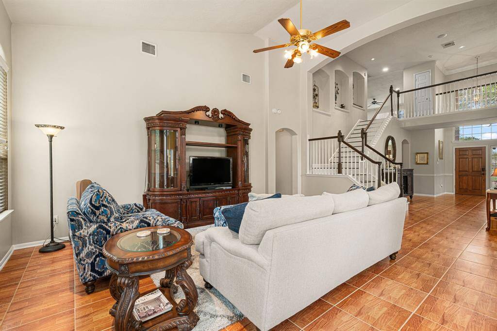 An easy, open flow from entry and formal dining/living spaces to the family room
