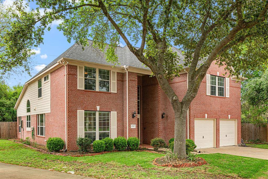 Impressive curb appeal with mature trees for this stately home on an oversized cul-de-sac lot