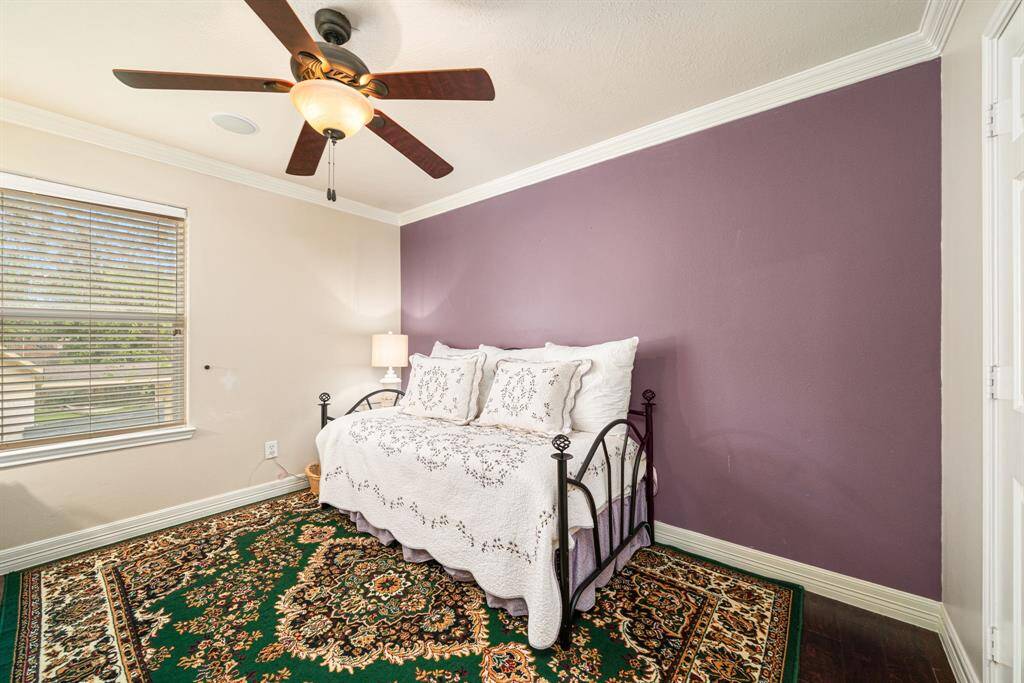 Bedroom 4 also offers lovely wood flooring, ceiling fan, and great closet space