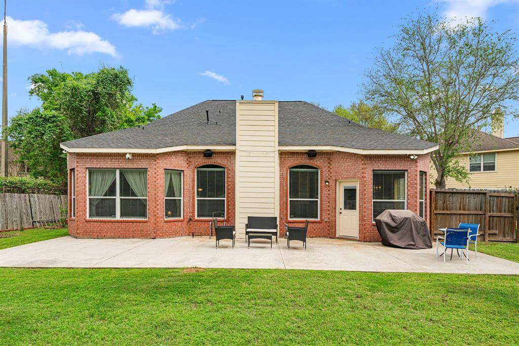 Step out back to the sprawling patio with plenty of room for outdoor cooking, entertaining, and relaxing