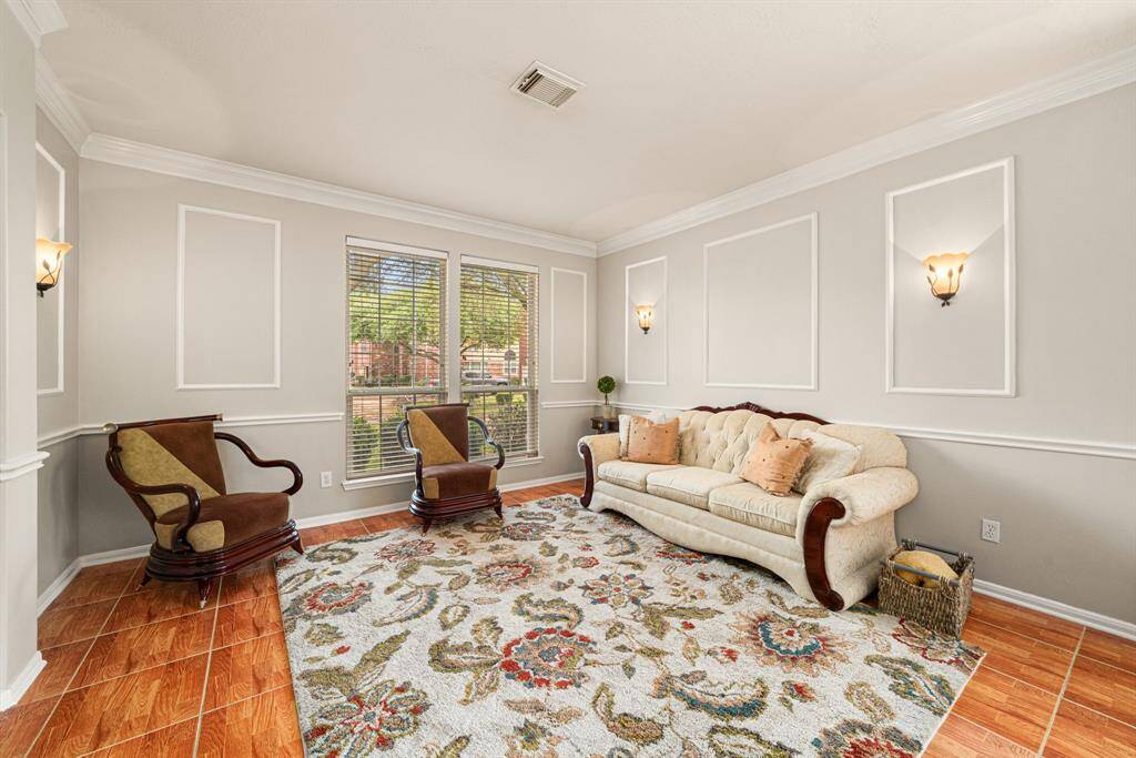 Notice the wall sconces at living and dining rooms creating an inviting ambiance